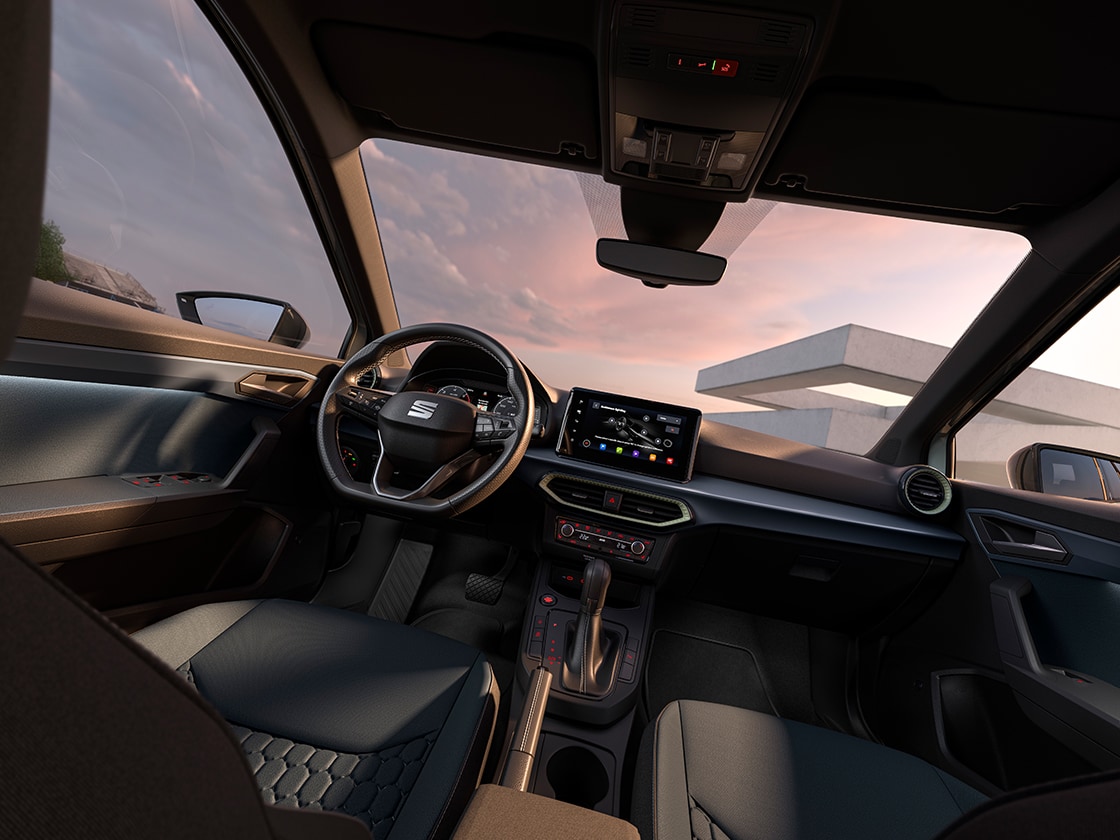 Interior view of the seat arona that showcases some design details, such as the steering wheel, the dashboard or part of the upholstery