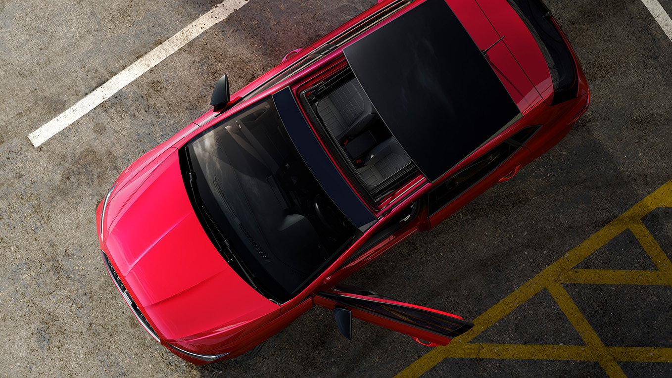 Seat ibiza upper view with an open sunroof. 