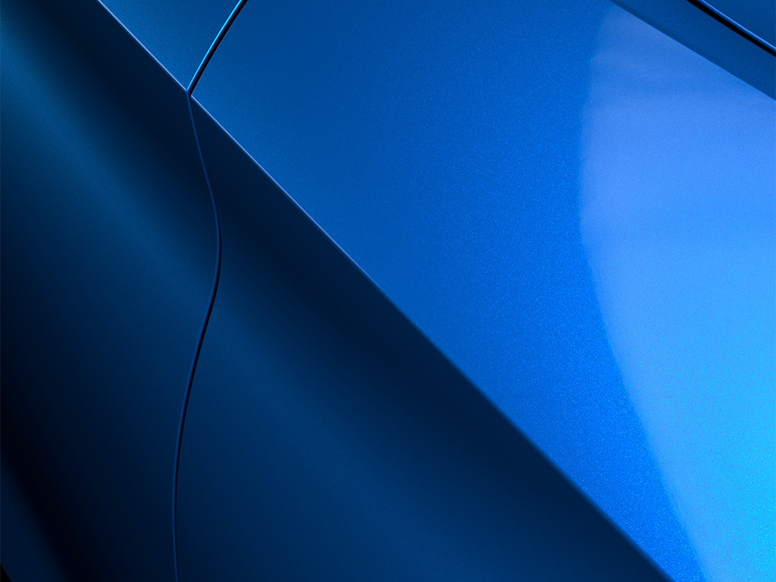 Seat leon sportstourer style with a sapphire blue metallic finish, close up.