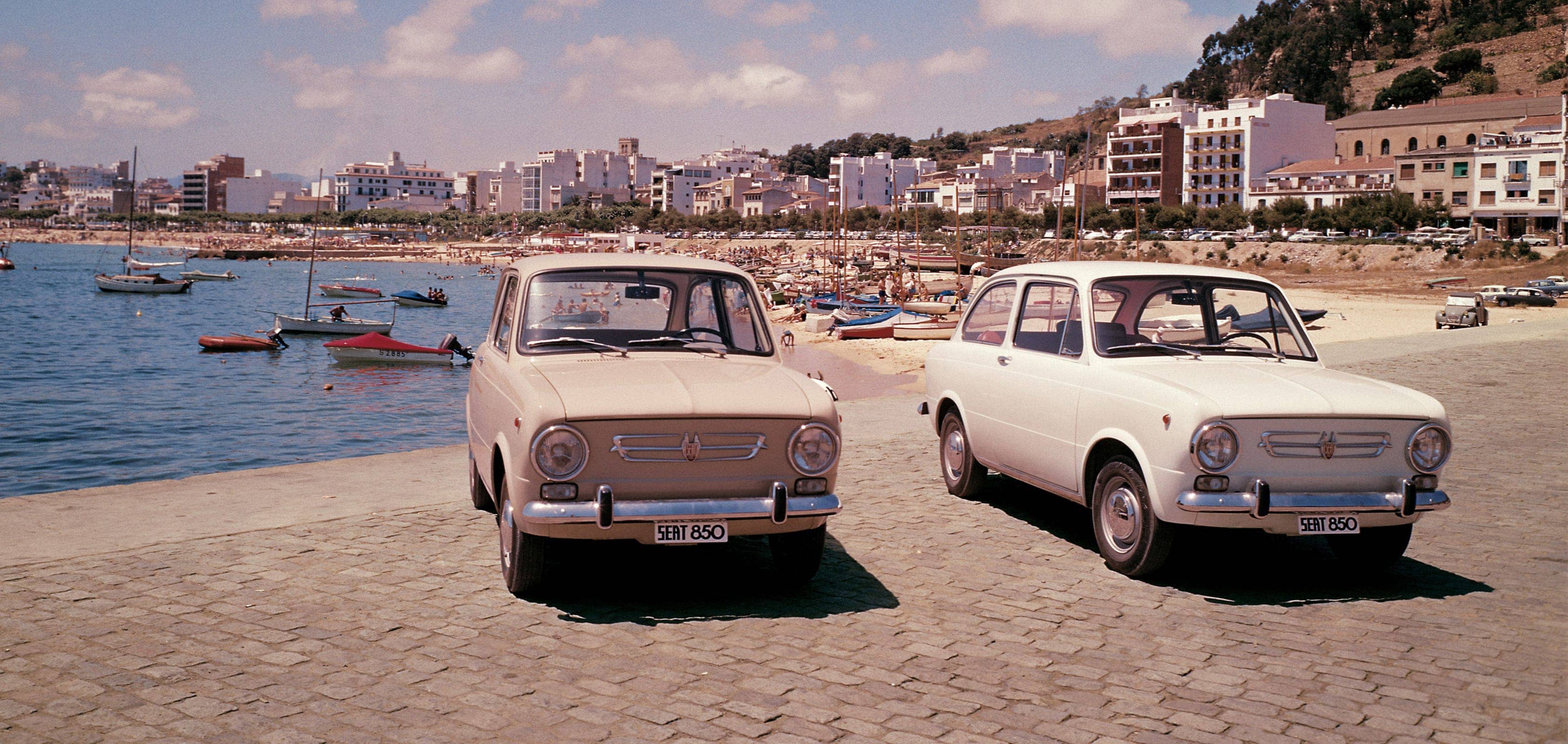 SEAT brand history 1960s exports - SEAT 850 cars on a beach header image