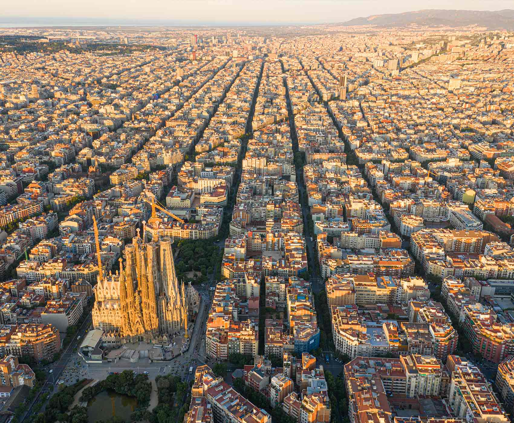 Aerial view of Barcelona city with Eixample district and Sagrada Familia cathedral pictured in the centre - SEAT Creative Living