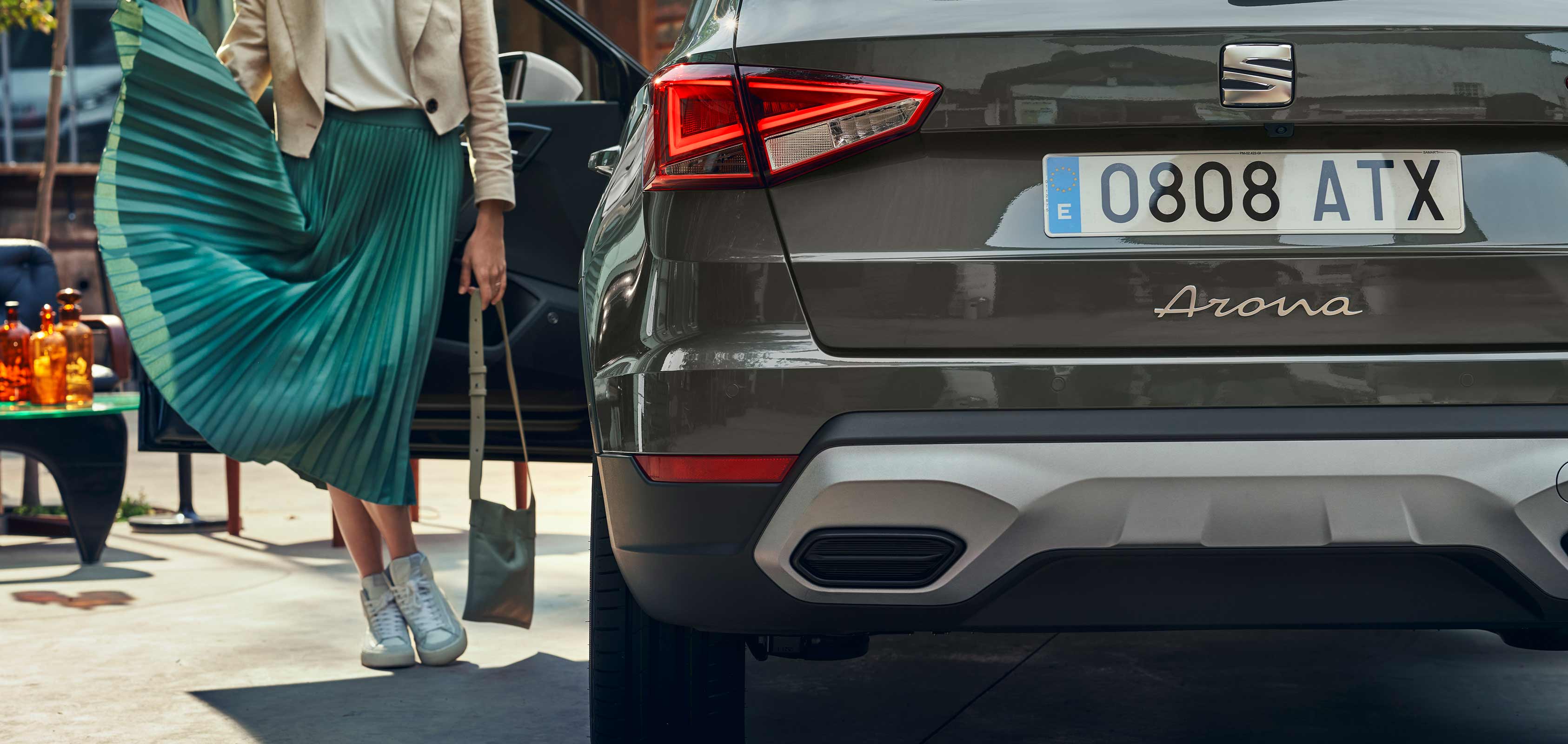 Rear view of SEAT Arona dark camouflage colour with a candy white roof   